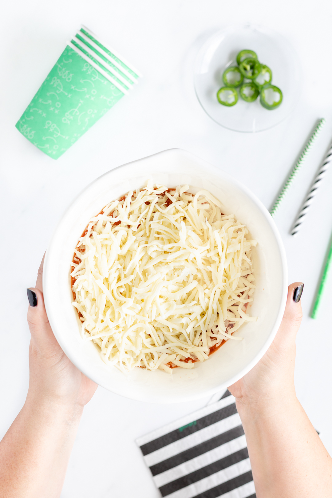 girl holding a bowl of cheese