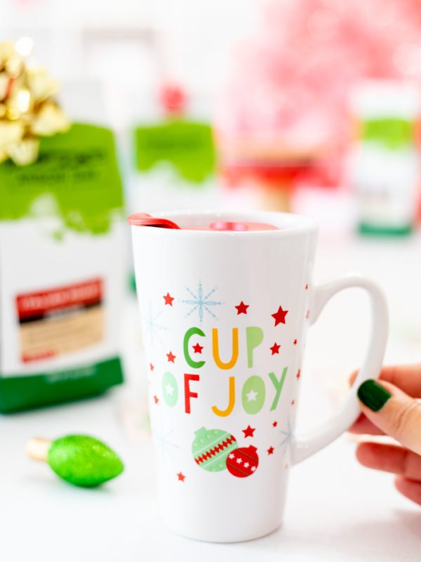 Girl Holding Cup of Joy Travel Mug