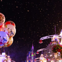 Disney Christmas Balloons on a snowy Main Street