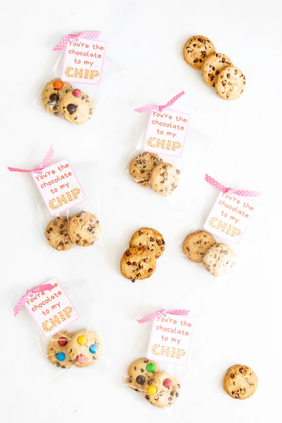 Printable Valentine Cards spread out with ribbons and more cookies