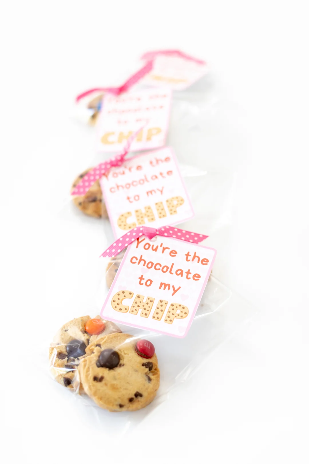 diy packages of cookies for valentine's day with pretty ribbon