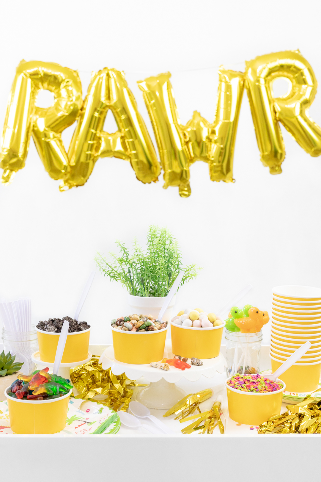 Rawr letter balloon with ice cream toppings with a dinosaur theme