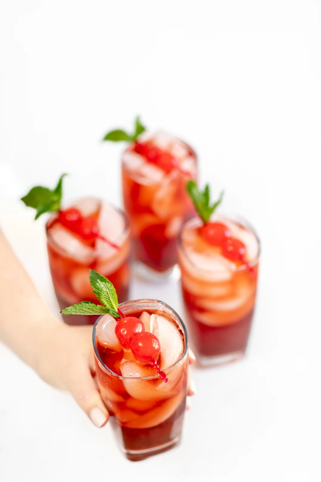 Iced tea with cherries and mint