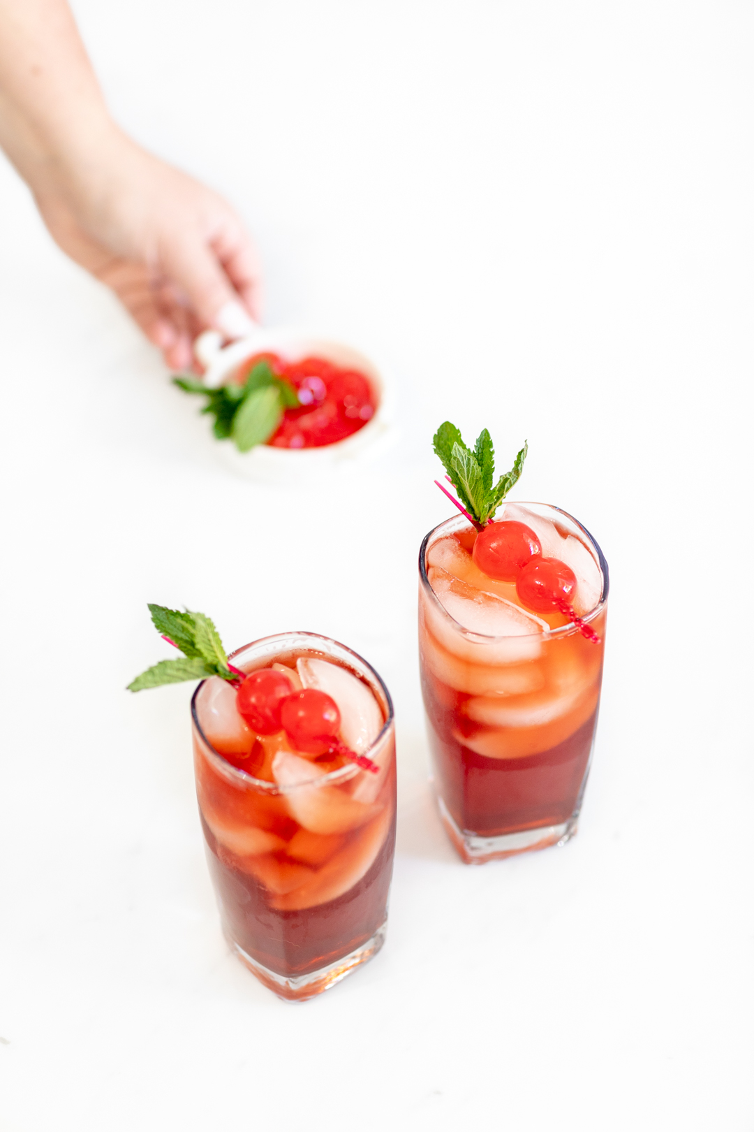 iced tea in glasses with pretty garnishes