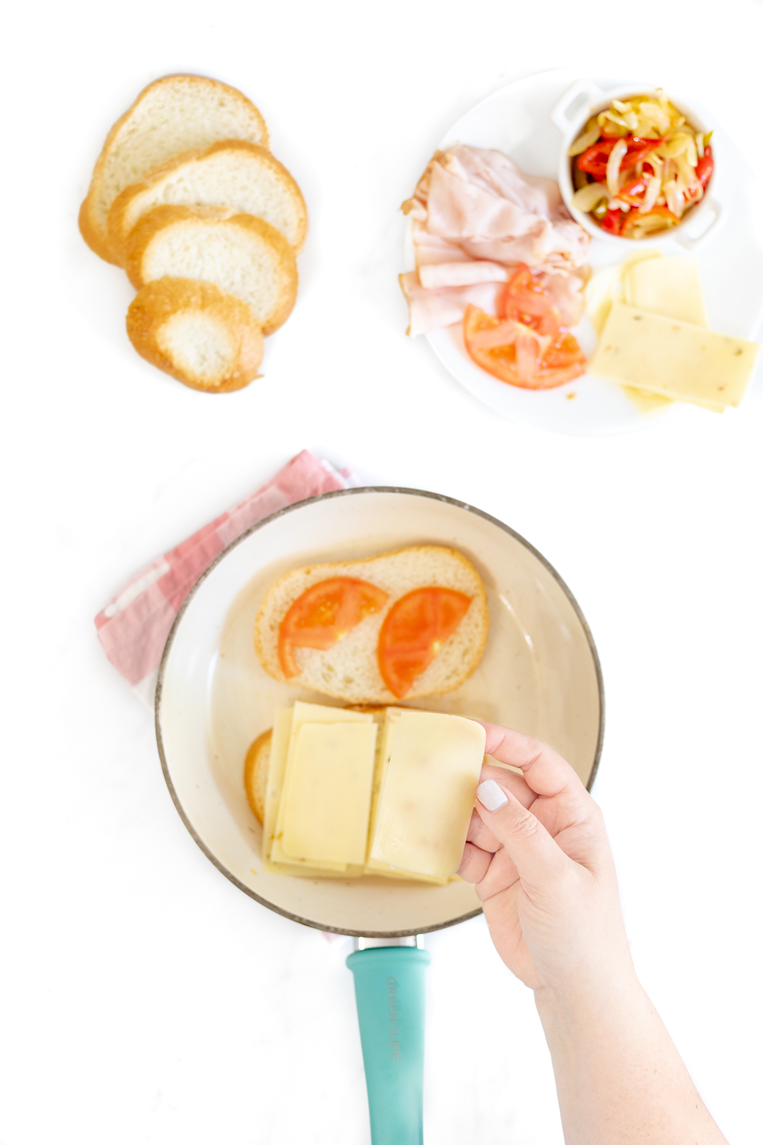 tomato and cheese sandwiches being made