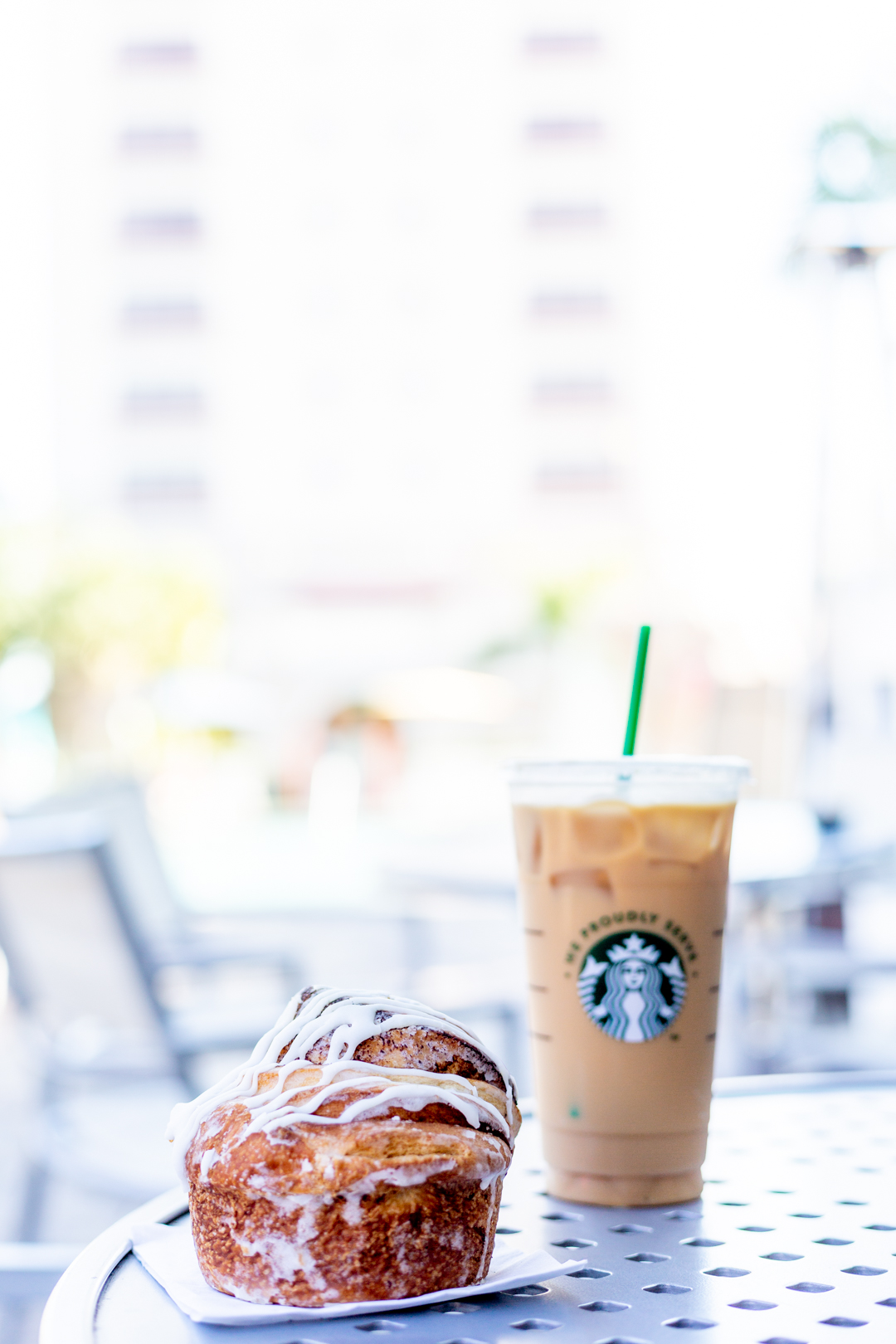 poolside breakfast with cinnamon roll and coffee