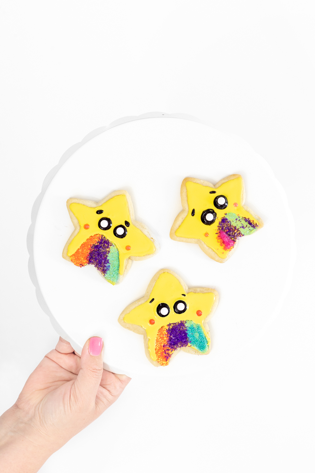 star cookies with yellow icing and colorful sprinkles
