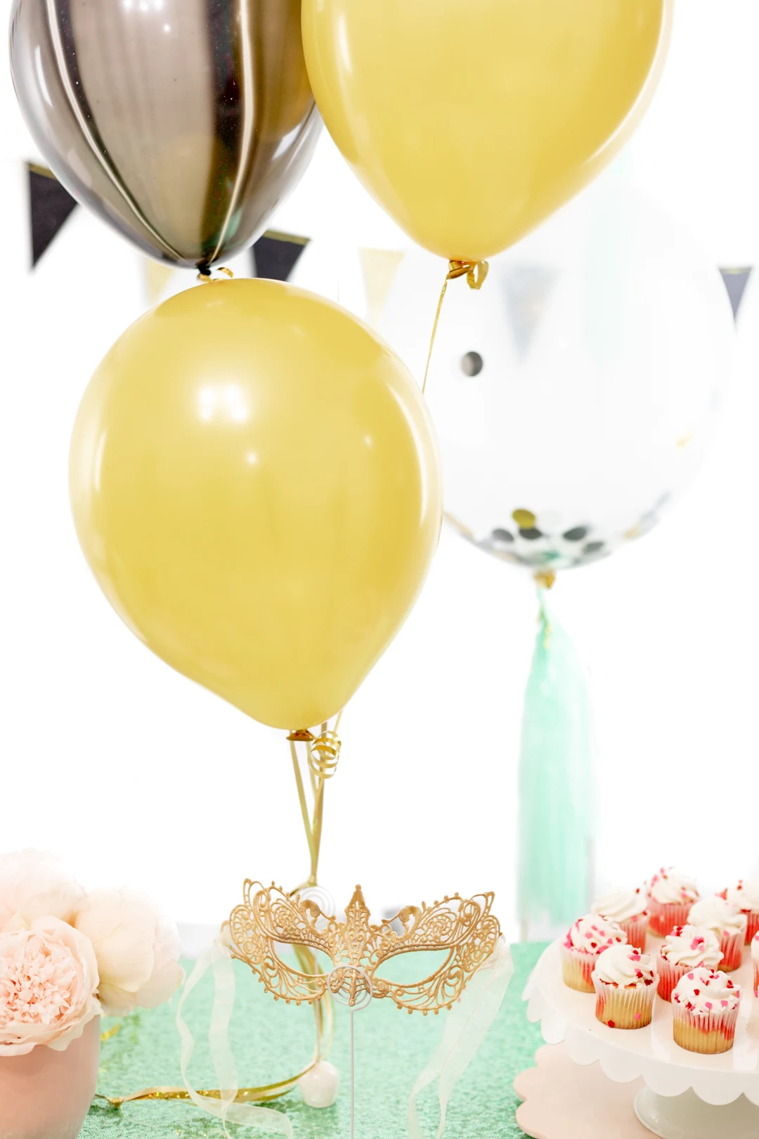 gold, black and teal balloons