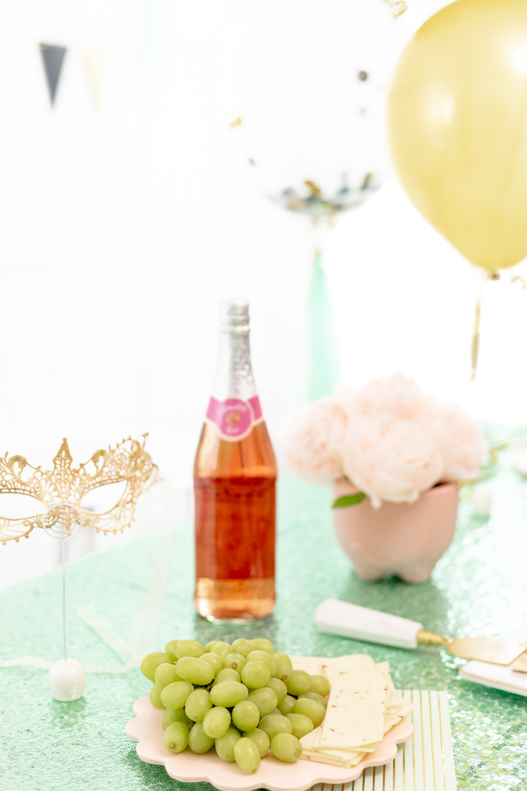 classy party table with sparkling juice and fresh fruit