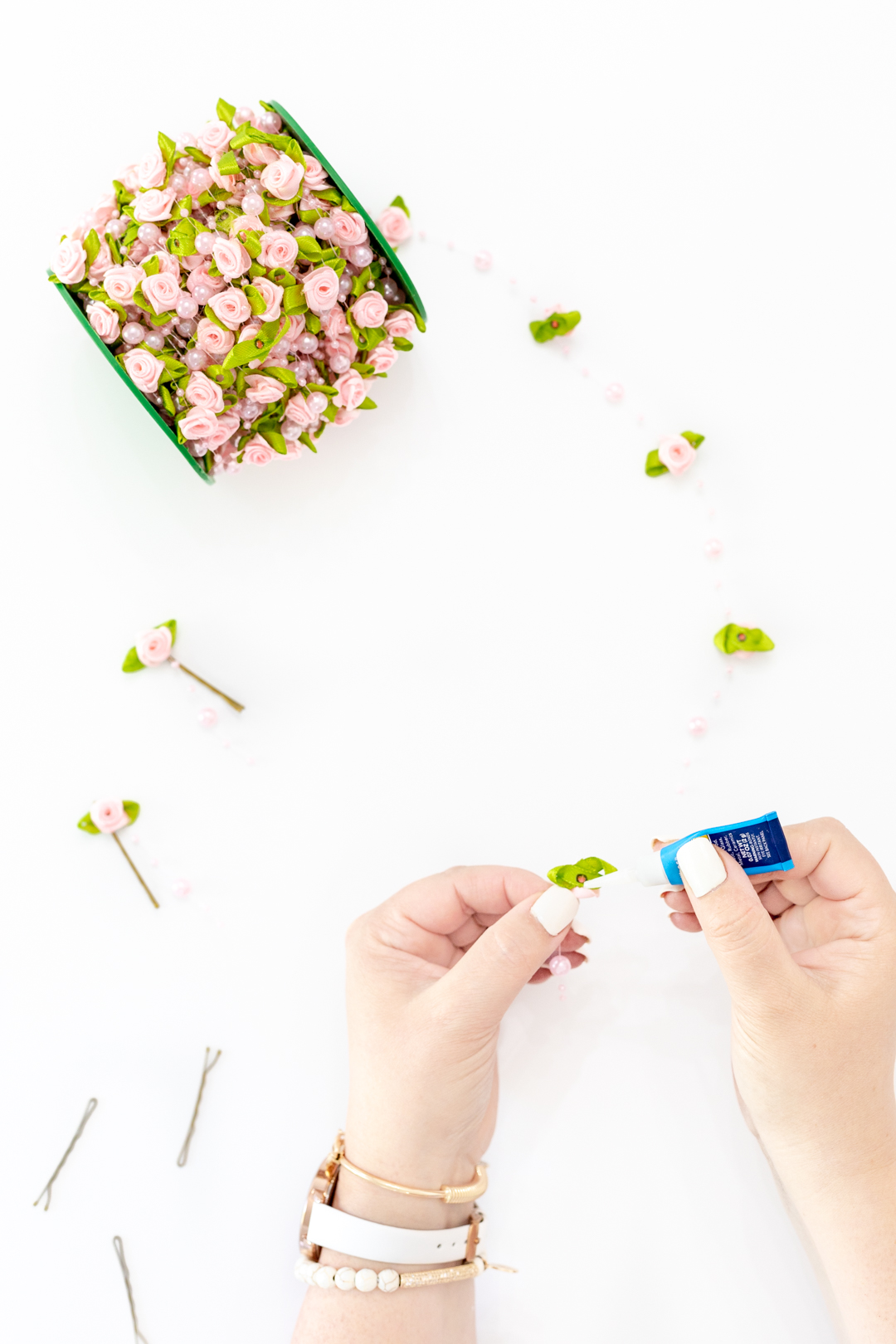 gluing flower onto a bobby pin