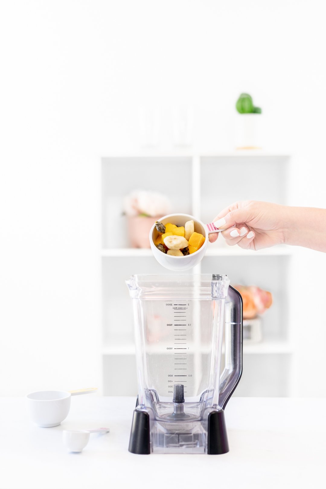 pouring fruit into blender