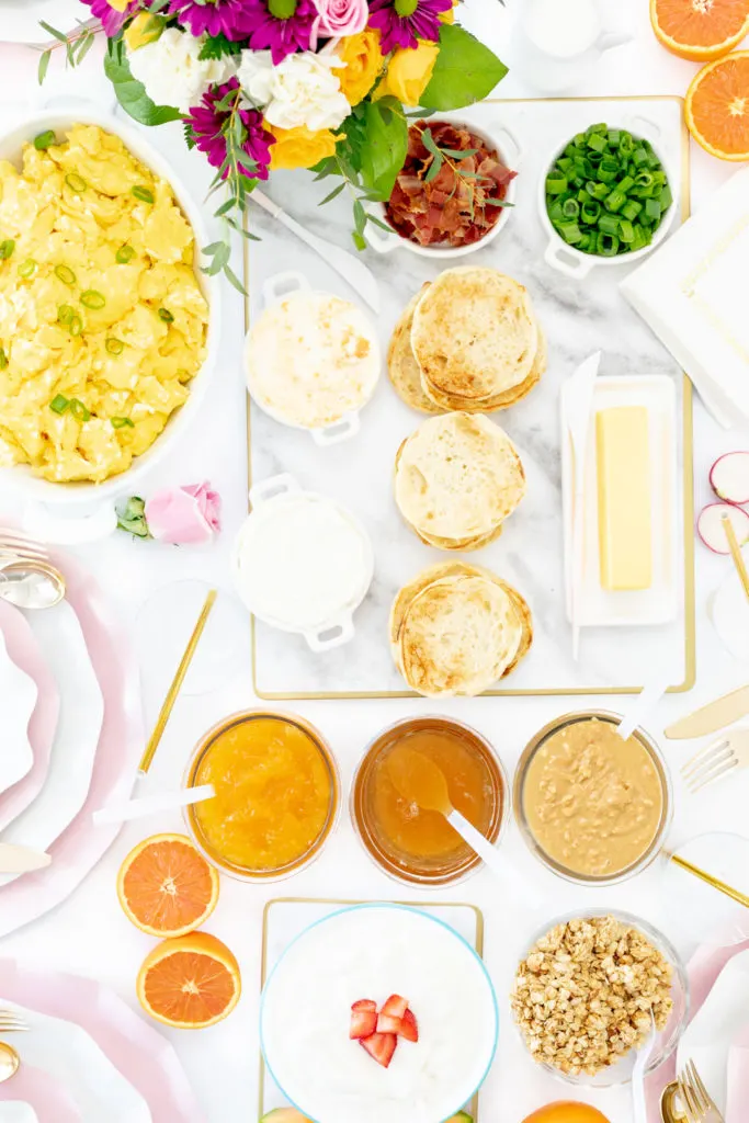 brunch spread with eggs, english muffins, spreads