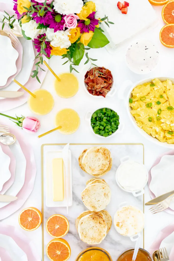 spring brunch spread with eggs, english muffins and orange juice