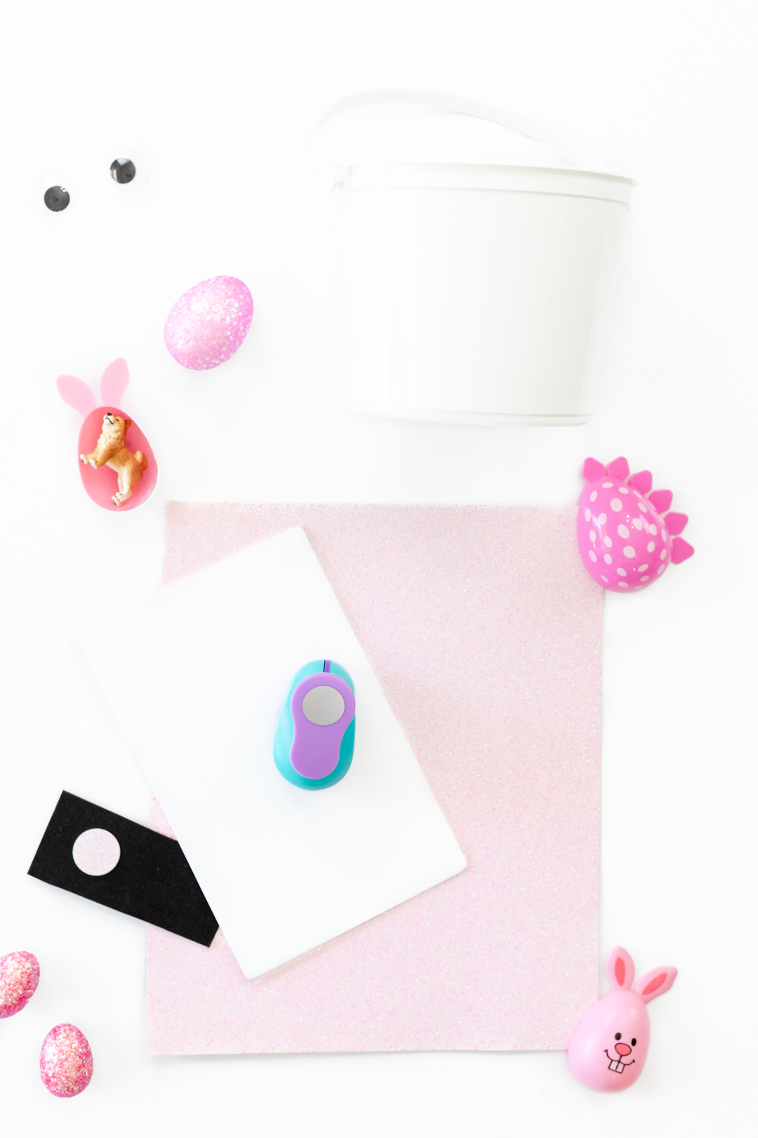 diy easter basket items. glitter paper, foam, glue, hole punch