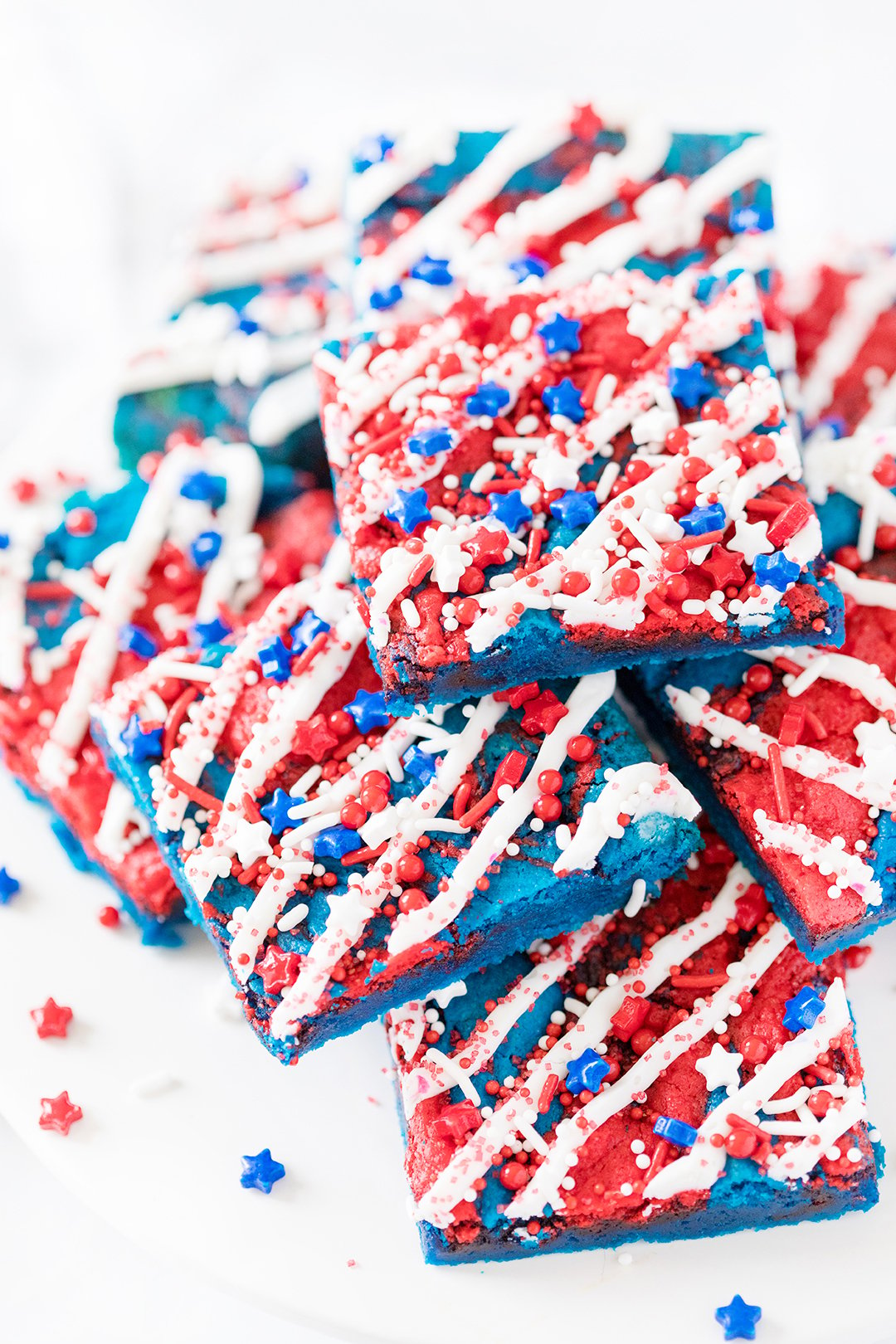 patriotic dessert bars with icing drizzle and sprinkles
