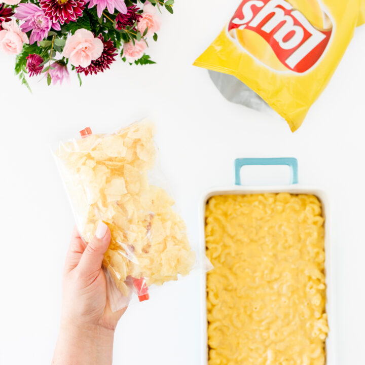 crushing potato chips in a plastic baggie