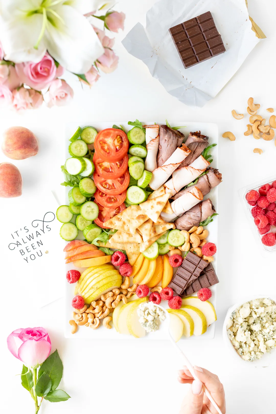 date night snack tray with meats, veggies and dessert