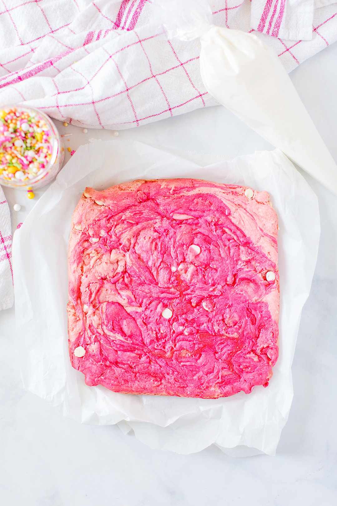 pink swirled blondie bars in baking dish