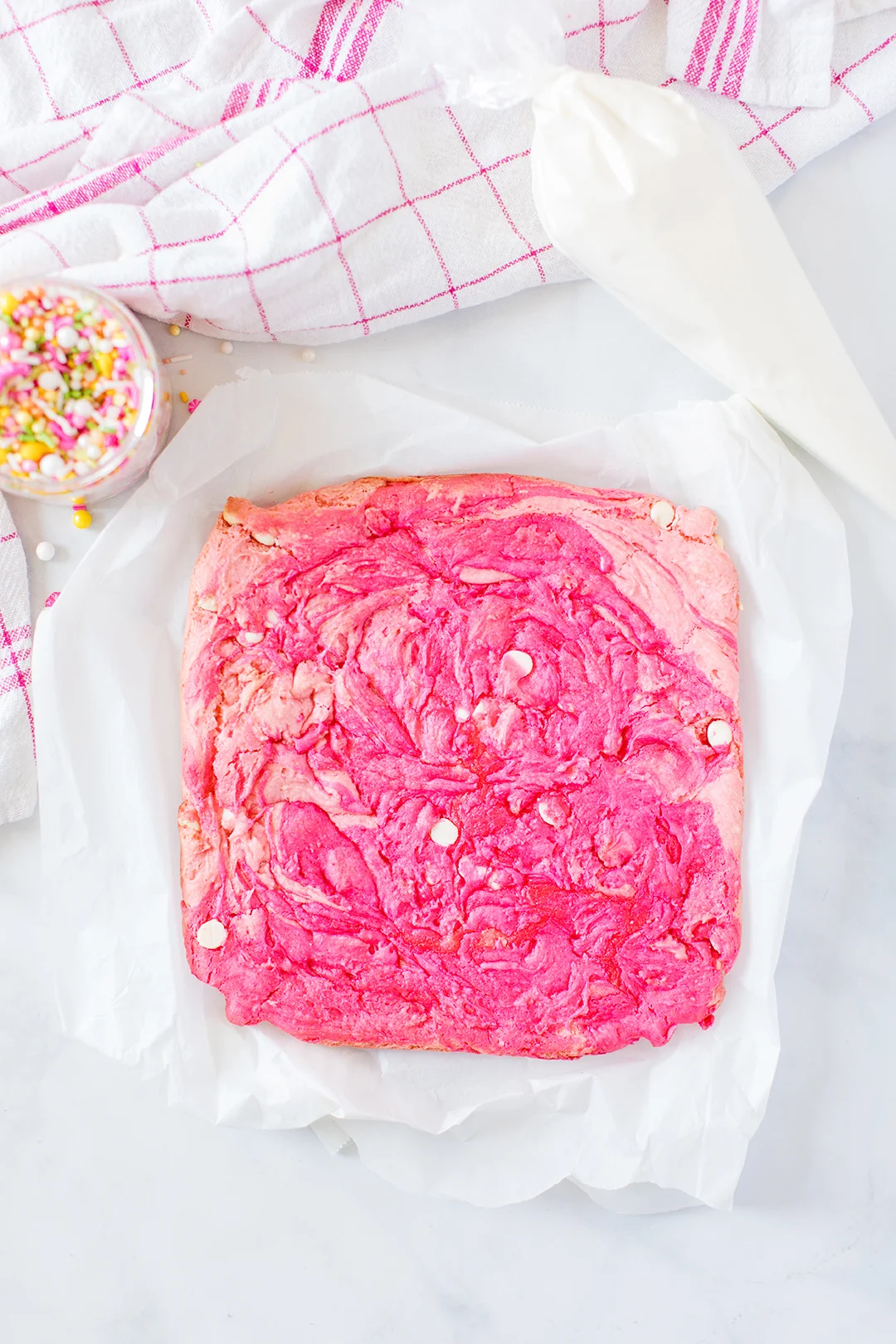 pink swirled blondie bars in baking dish