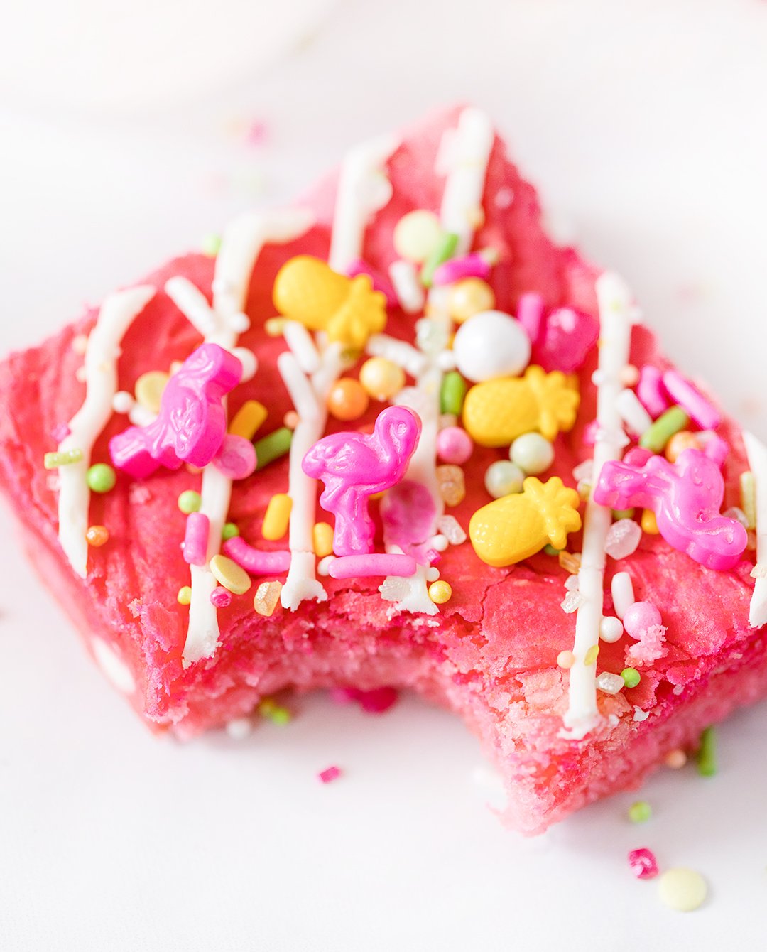 Flamingo sprinkles on top of pretty pink blondies