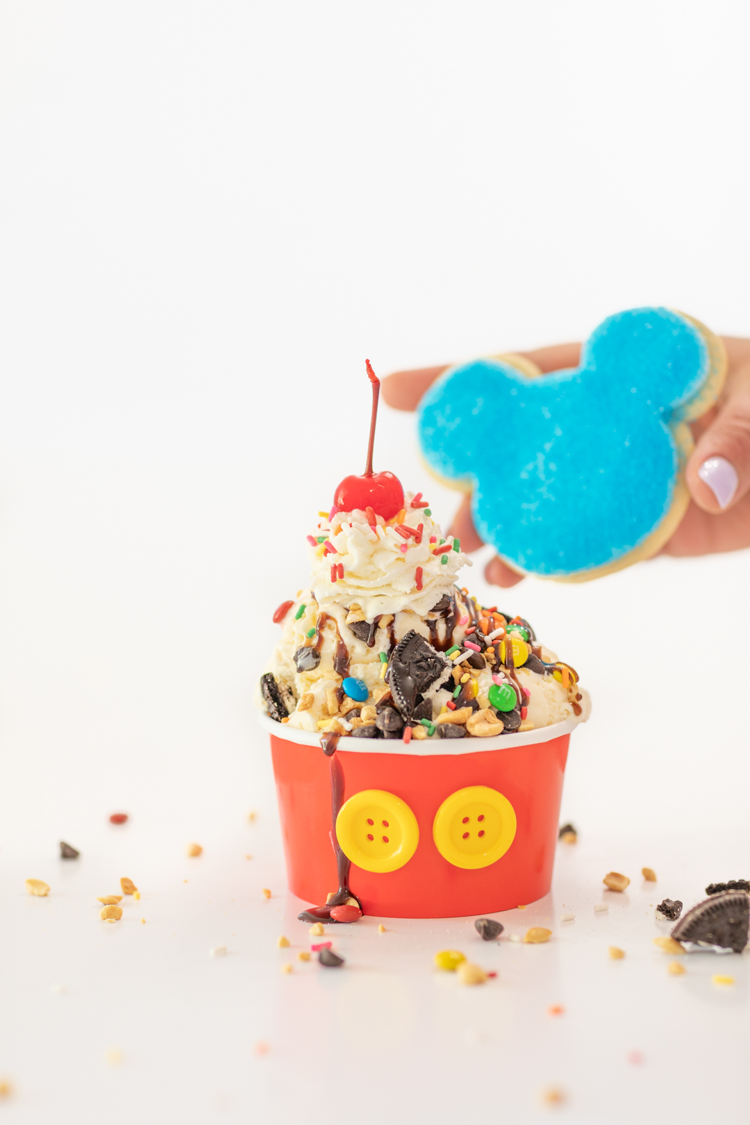 Adding Mickey Shaped Cookie to Sundae