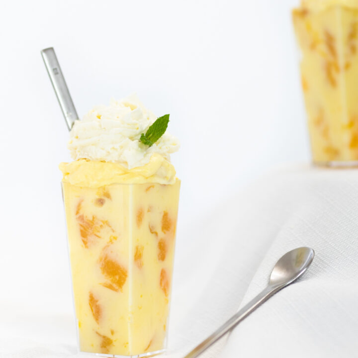 Peach pudding parfaits with a dash of mint for garnish