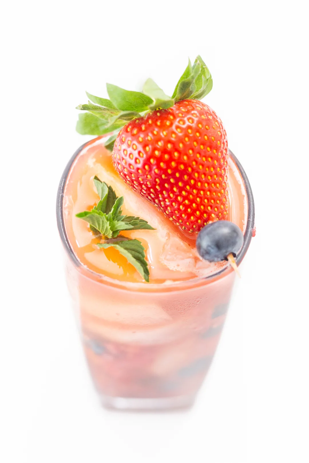 fresh iced tea with strawberry, blueberry and mint