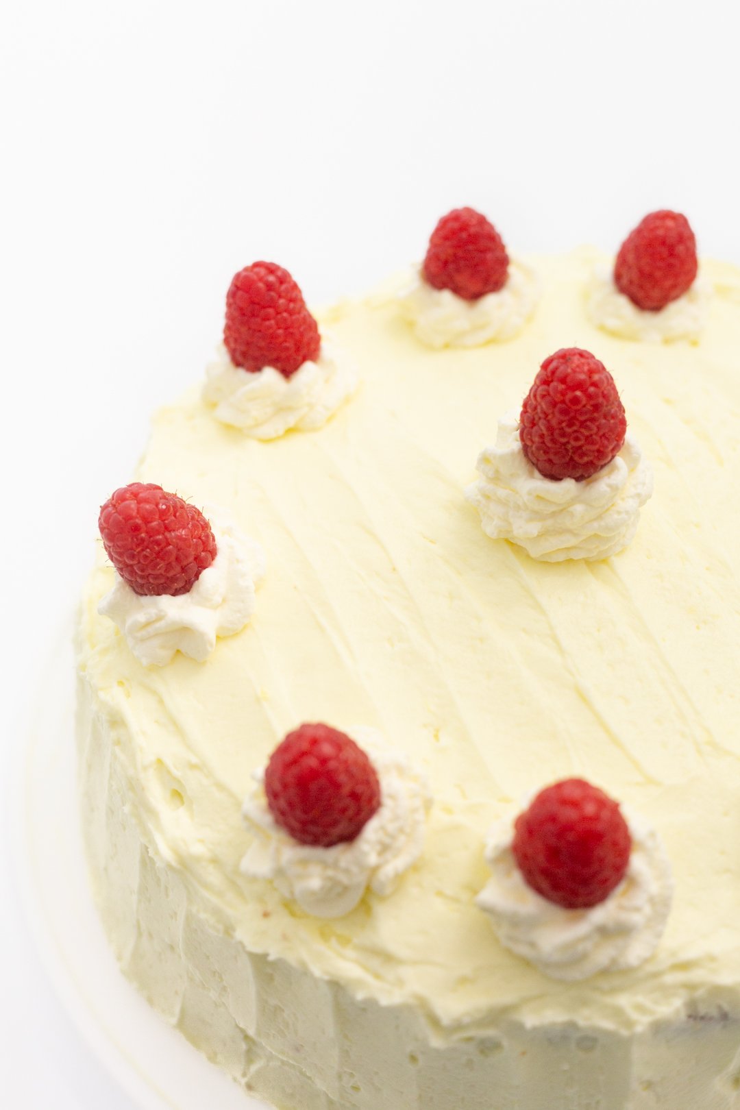 Whipped Lemon Frosting with Fresh Raspberries and Whipped Cream