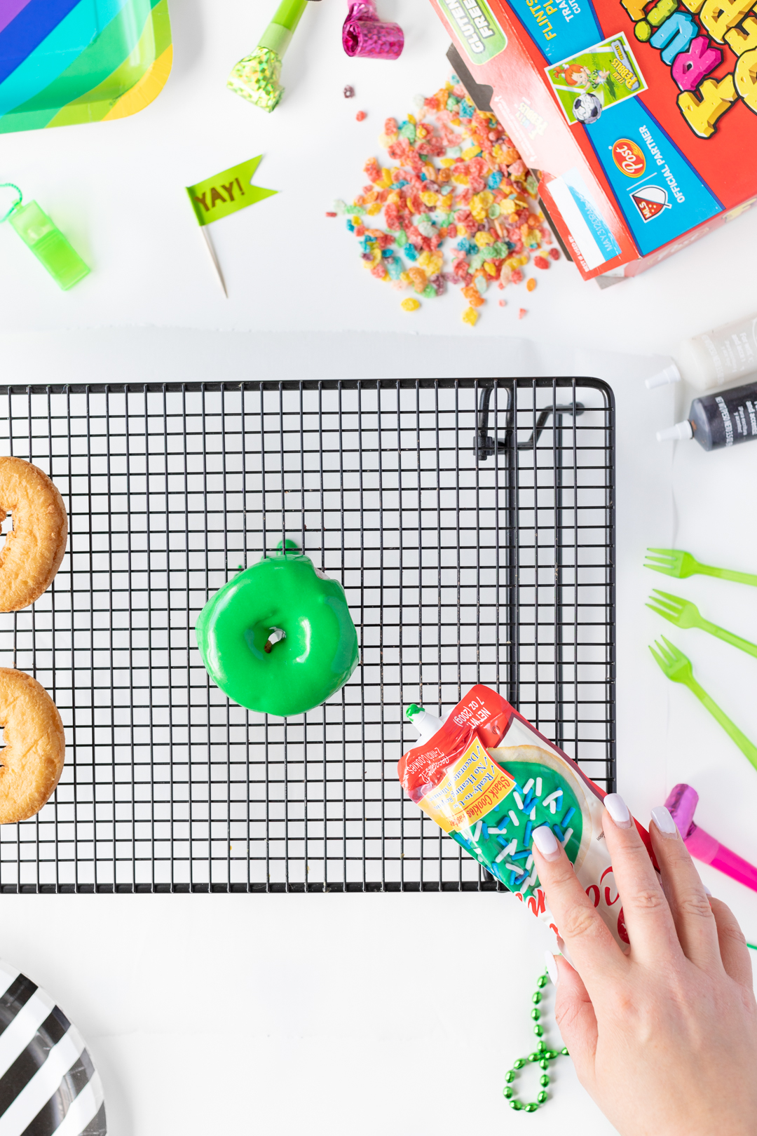 Making Soccer Field Donuts with Green Icing.