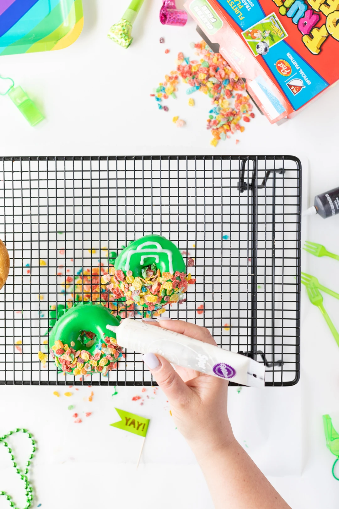 Decorating Donuts with colorful cereal and icing.