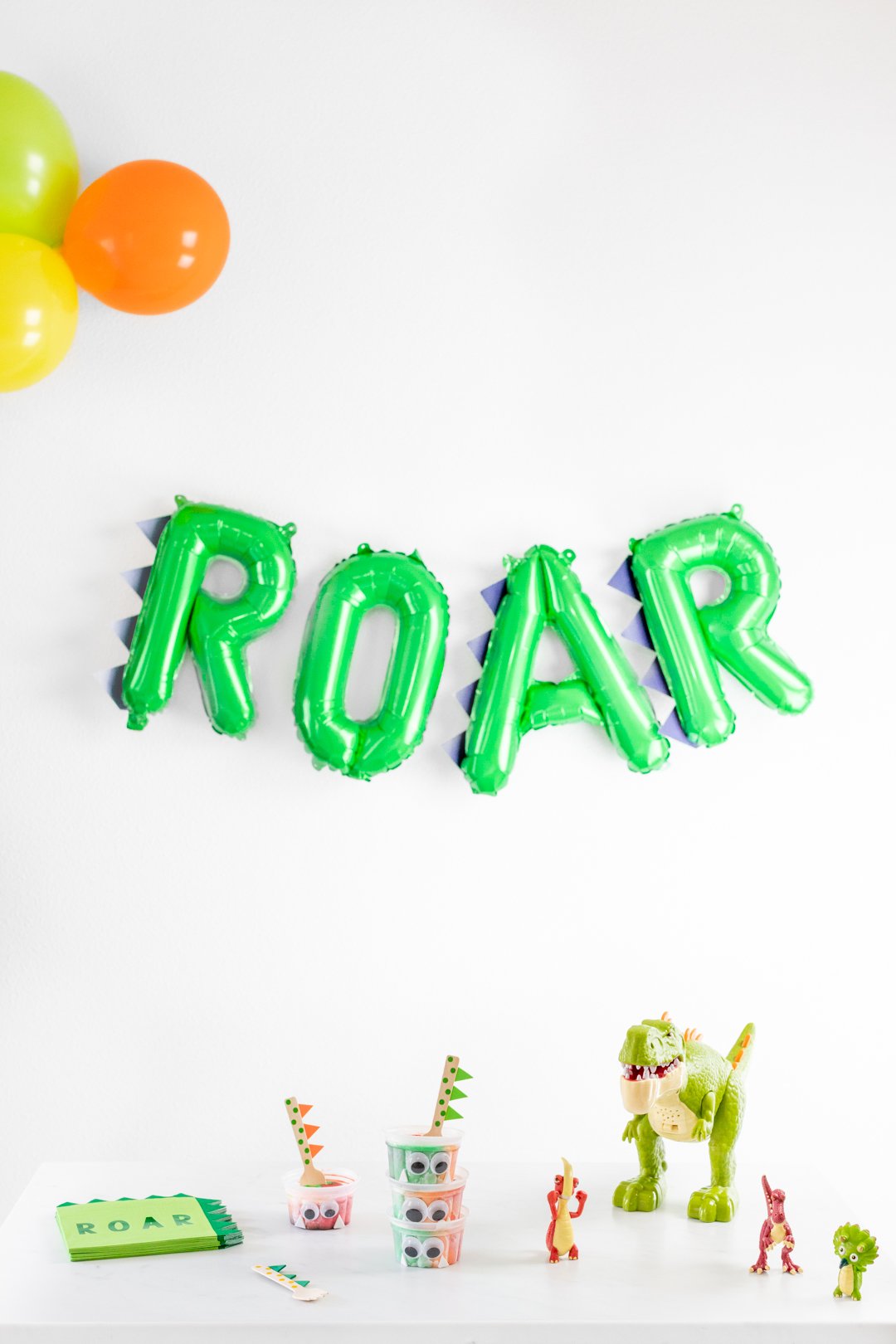 Roar balloon and dinosaur toys and party supplies