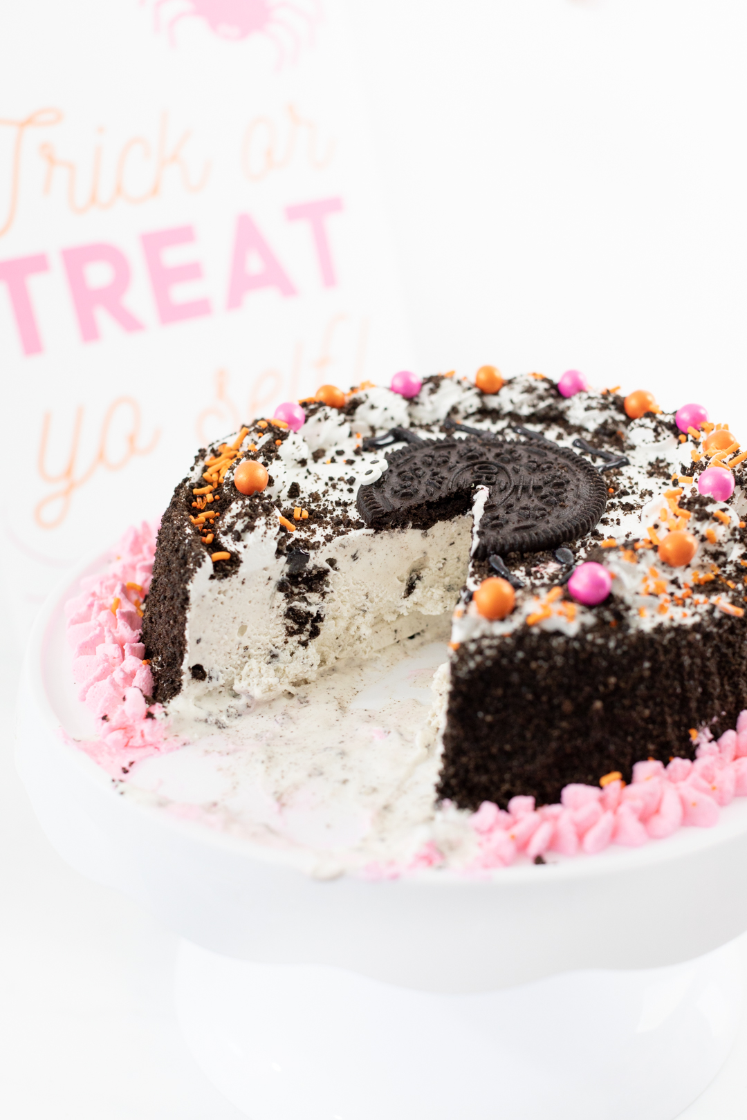 OREO Ice Cream cake with pink and orange embellishments.