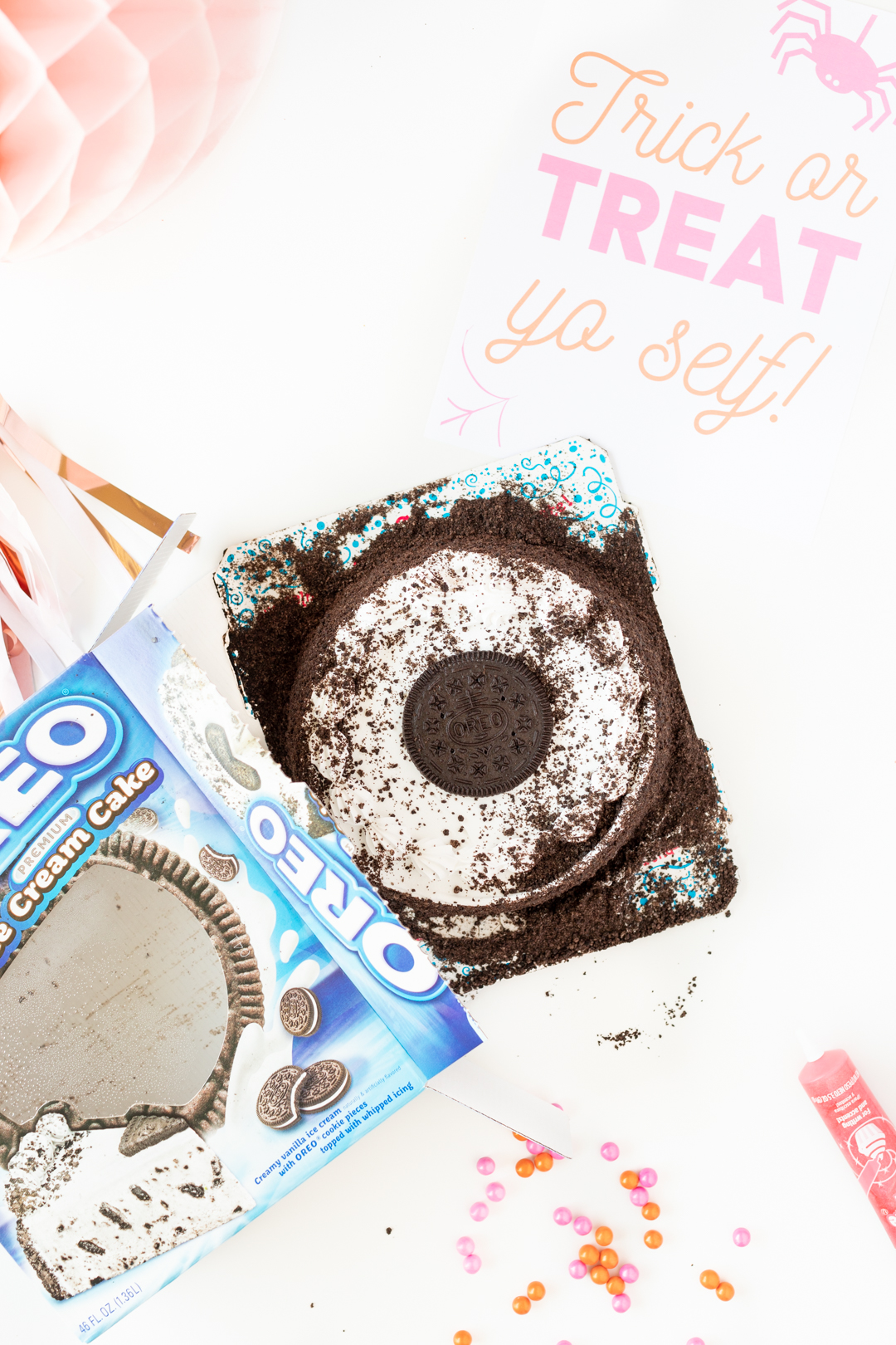 OREO ice cream cake being removed from box packaging.