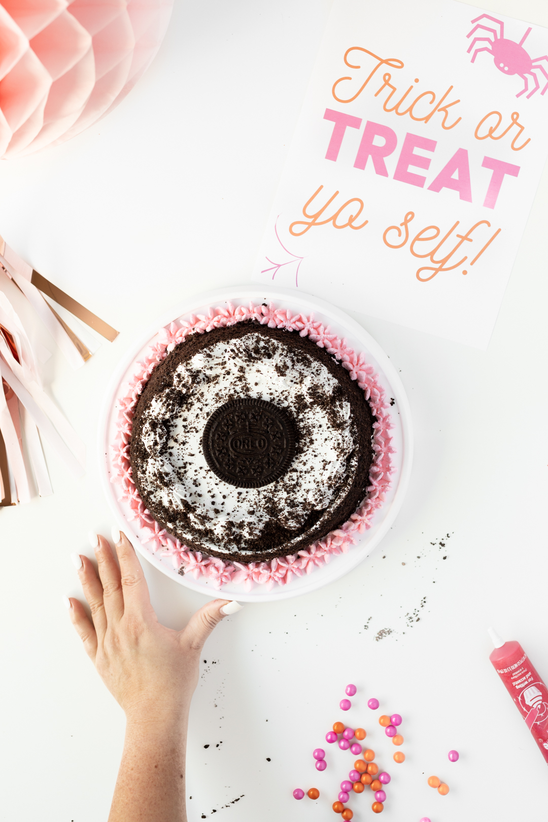 Pink icing added to store-bought OREO ice cream cake.