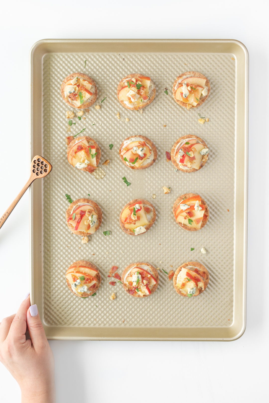 mini pita apple appetizers spread out on a baking sheet