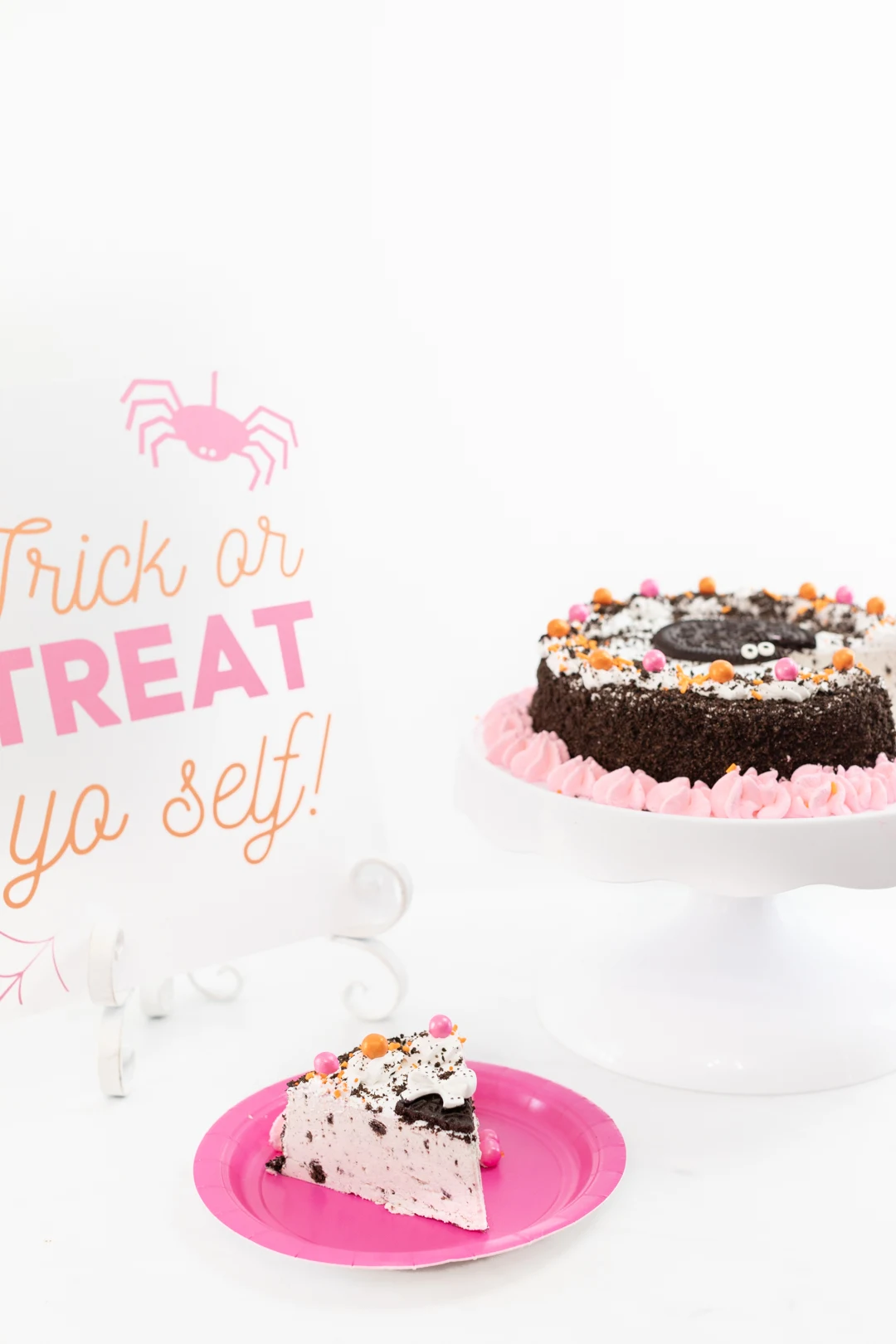 Delish OREO Premium Ice Cream Cake Embellished with pretty pink details for Halloween.