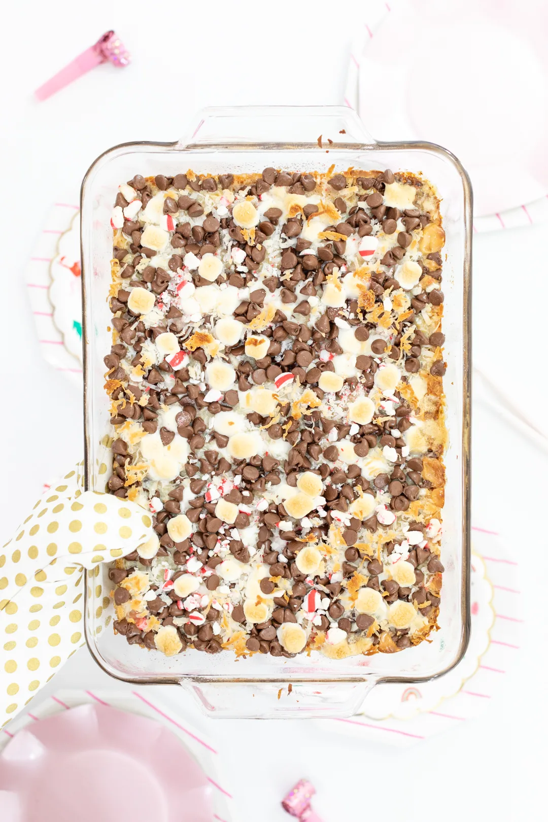 Magic Layer Cookie Bars warmed from the oven in baking dish.