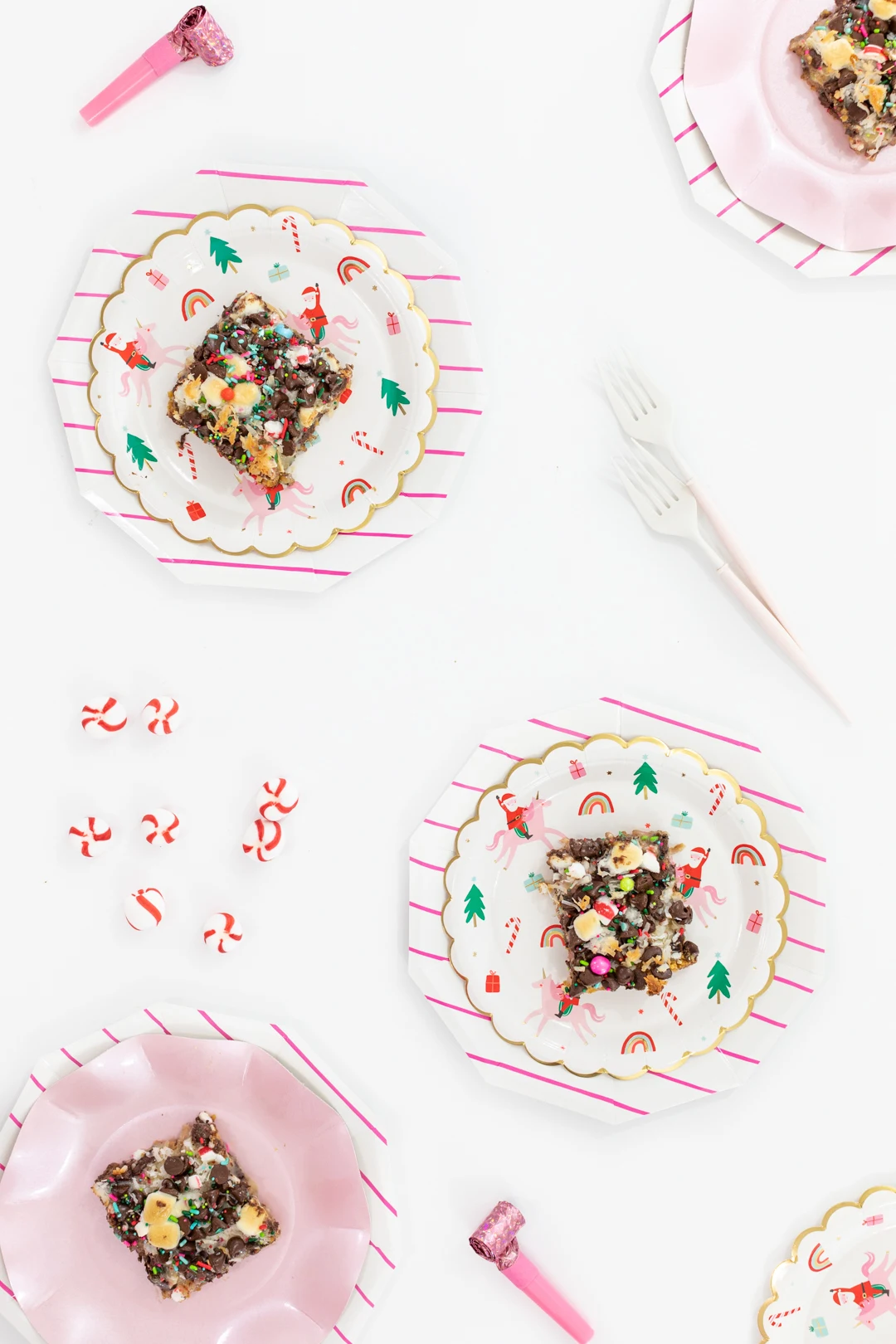 Christmas Magic Layer Bars with pretty sprinkles & pink Christmas party supplies.