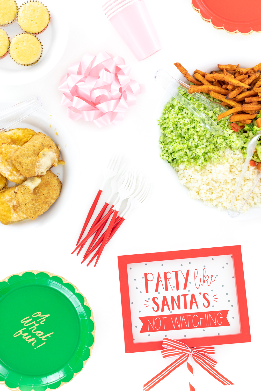 Food spread and Party Like Santa's Not Watching Sign