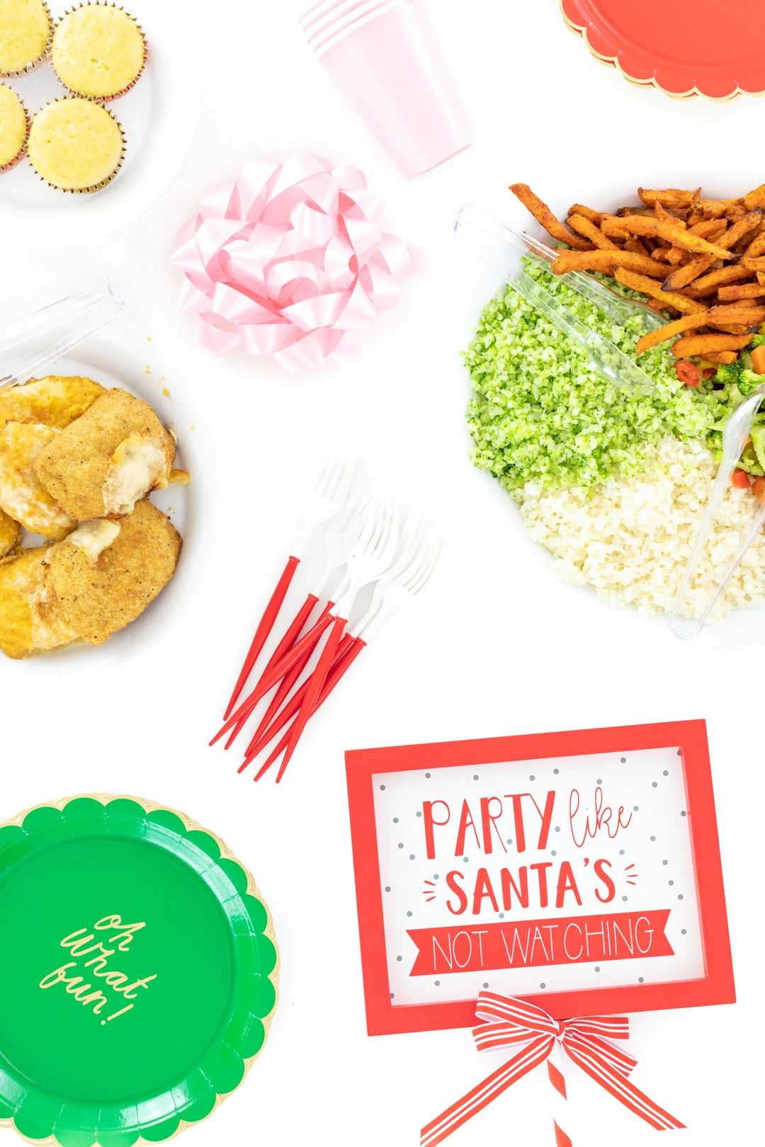 Food spread and Party Like Santa's Not Watching Sign