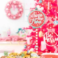 Santa Stop Here Party Sign and holiday snack board spread