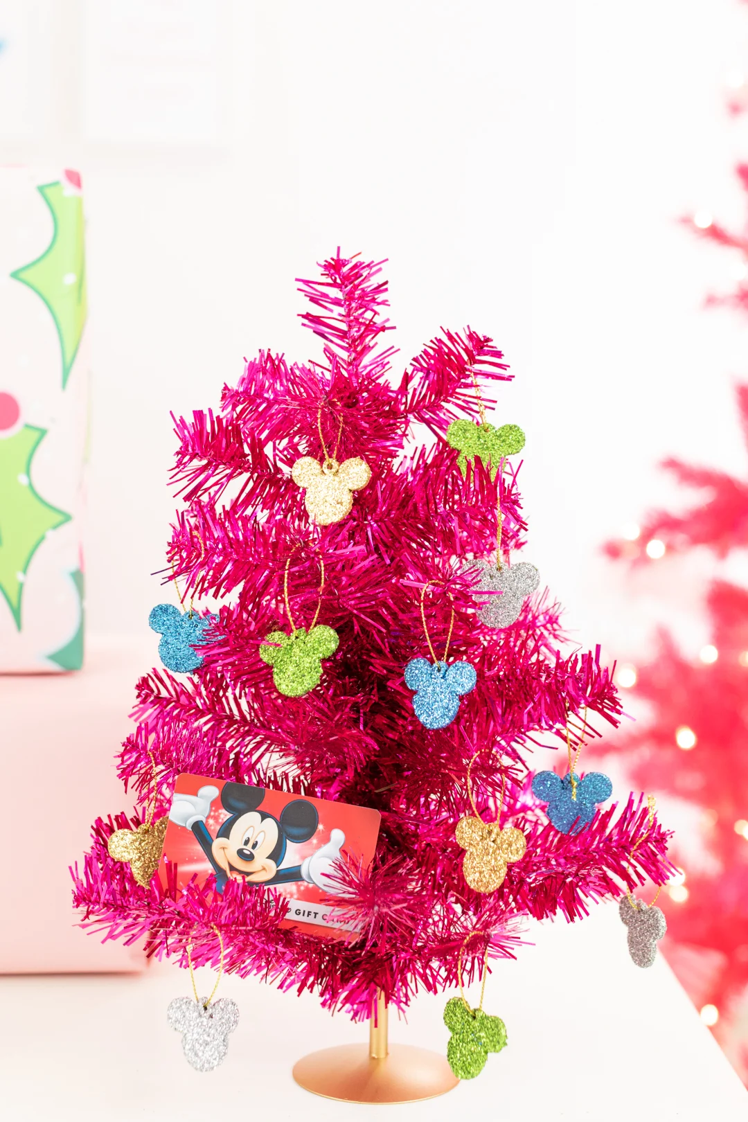 Mini Pink Disney Christmas Tree with mini glitter mickey ornaments.