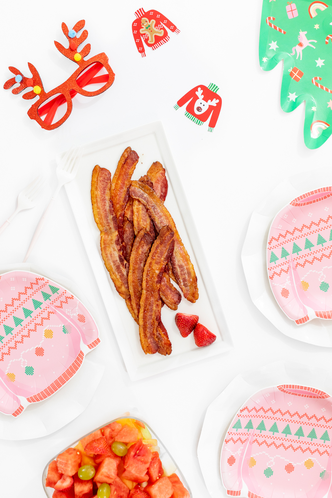 Ugly Sweater Brunch Spread with the cutest plates and bacon.