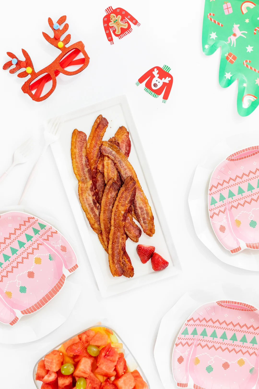 Ugly Sweater Brunch Spread with the cutest plates and bacon.