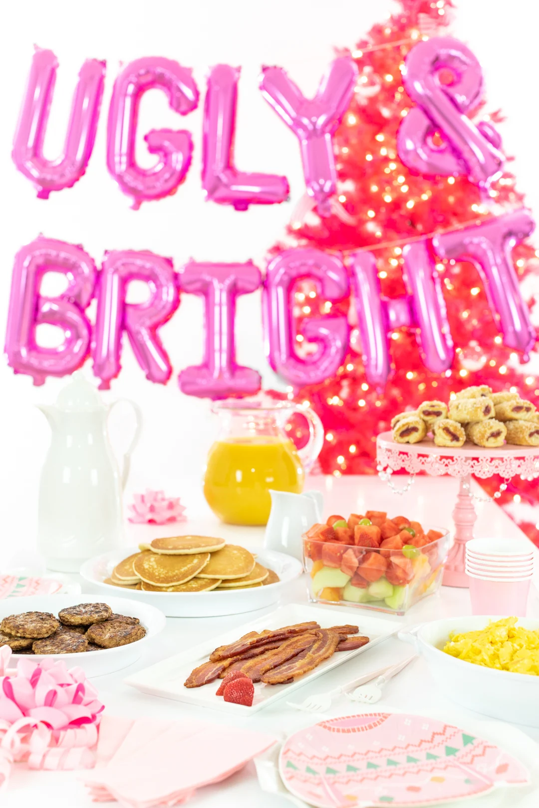 Fun holiday brunch spread with ugly & bright balloons and classic brunch ingredients.