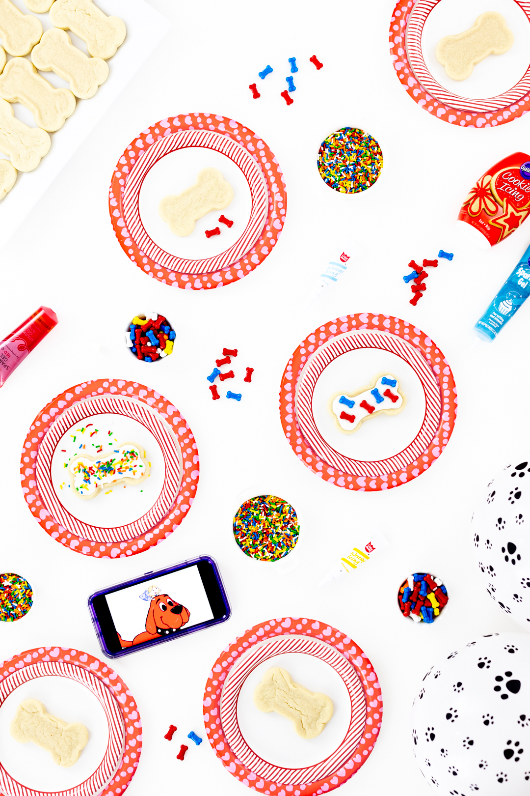 dog party table with dog bone cookies and sprinkles