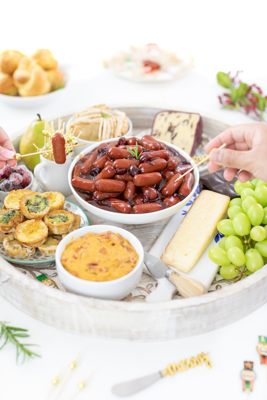 using cocktail picks to pick up lil smokies appetizers