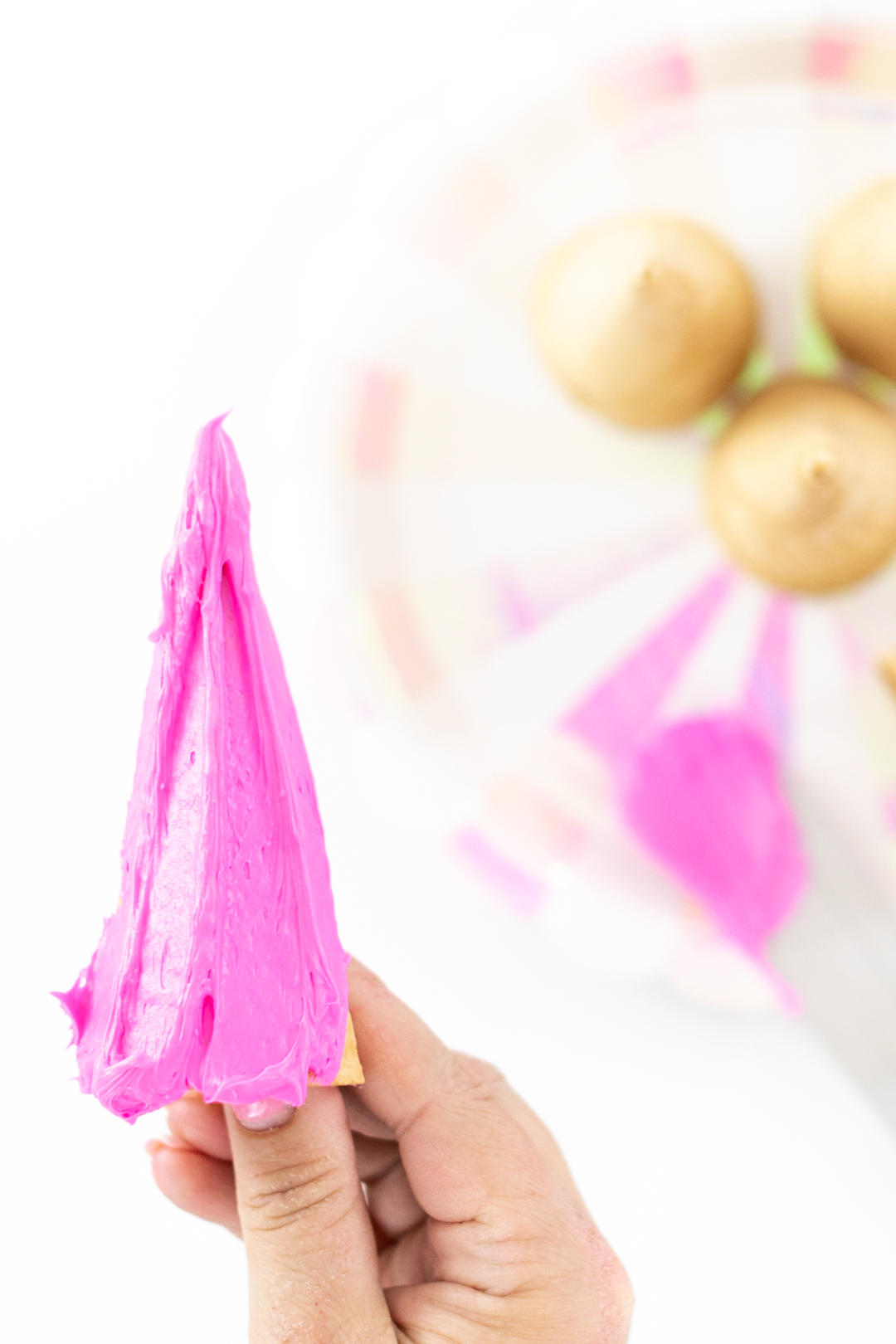 Pink frosting on ice cream cone