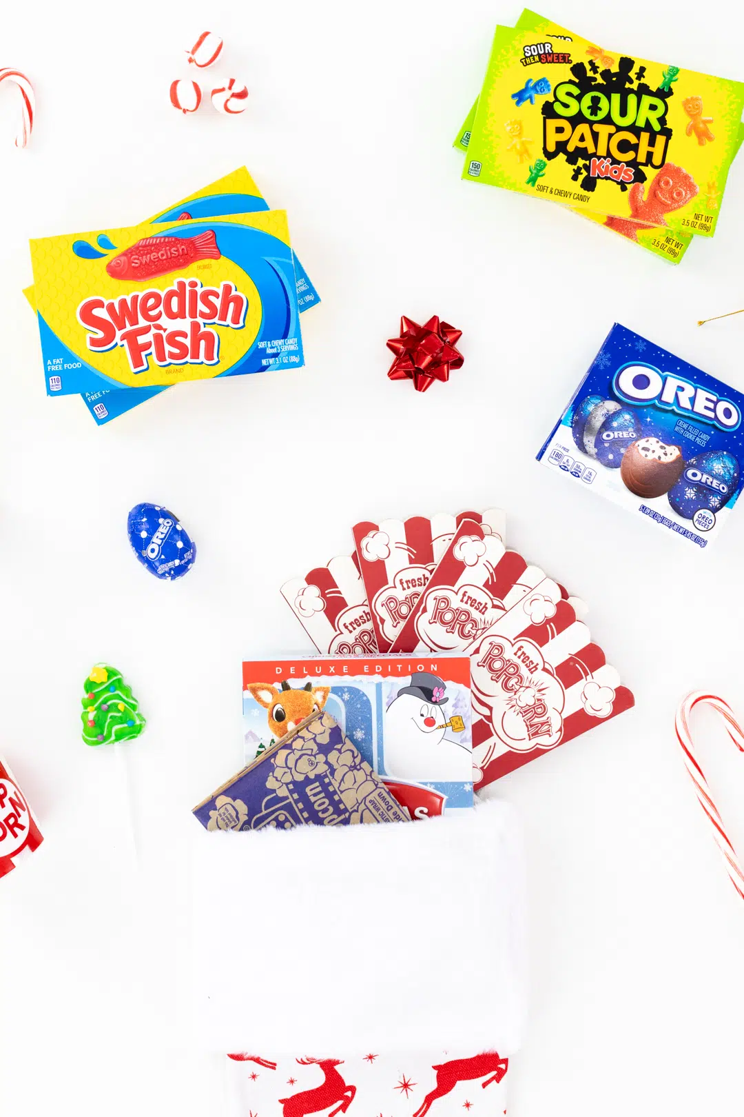 movie themed stocking with fillers like microwave popcorn, candy, popcorn ornament and more