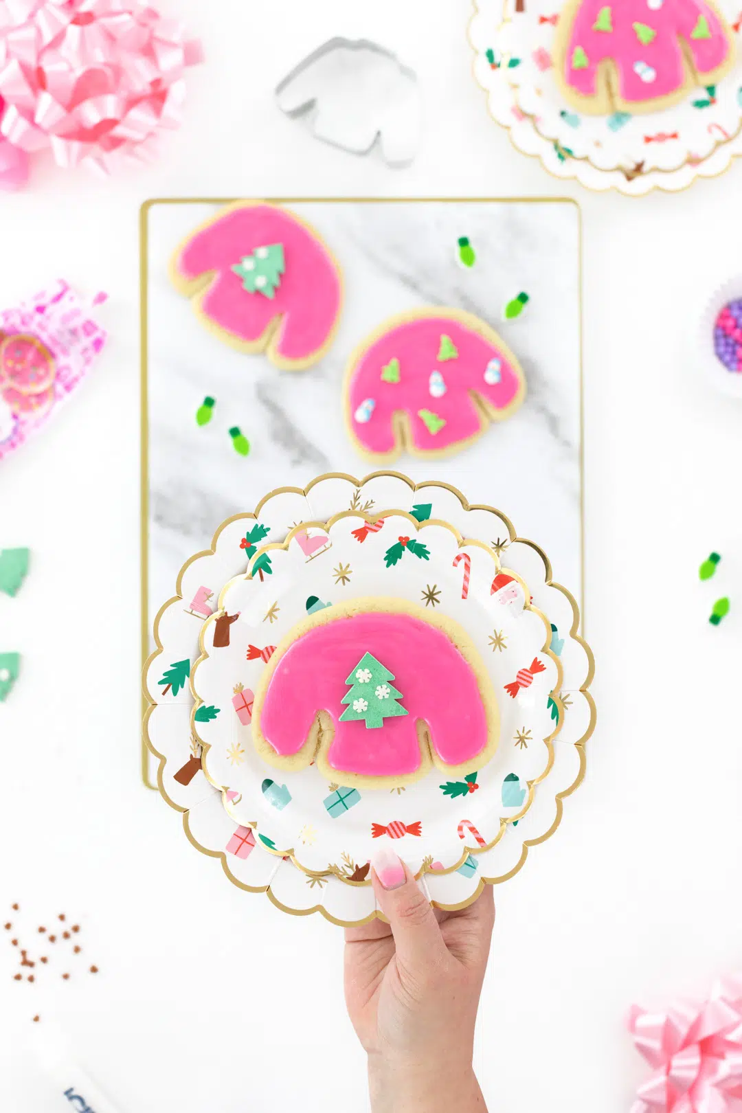 pink ugly sweater cookie on a plate